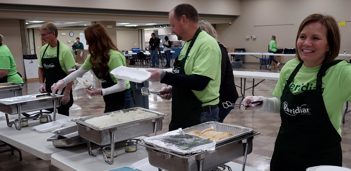 Veridian executive team serving a thanksgiving meal