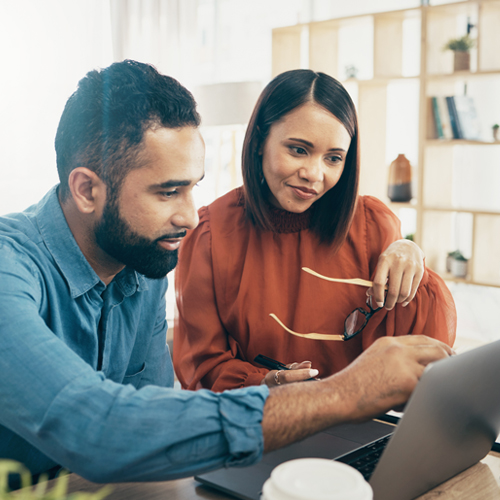 Couple researching on a computer