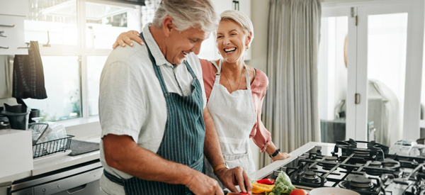 Couple cooking carefree in a kitchen